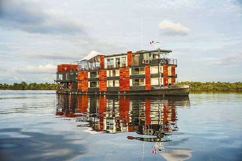 A classic riverboat navigating a calm Amazon tributary